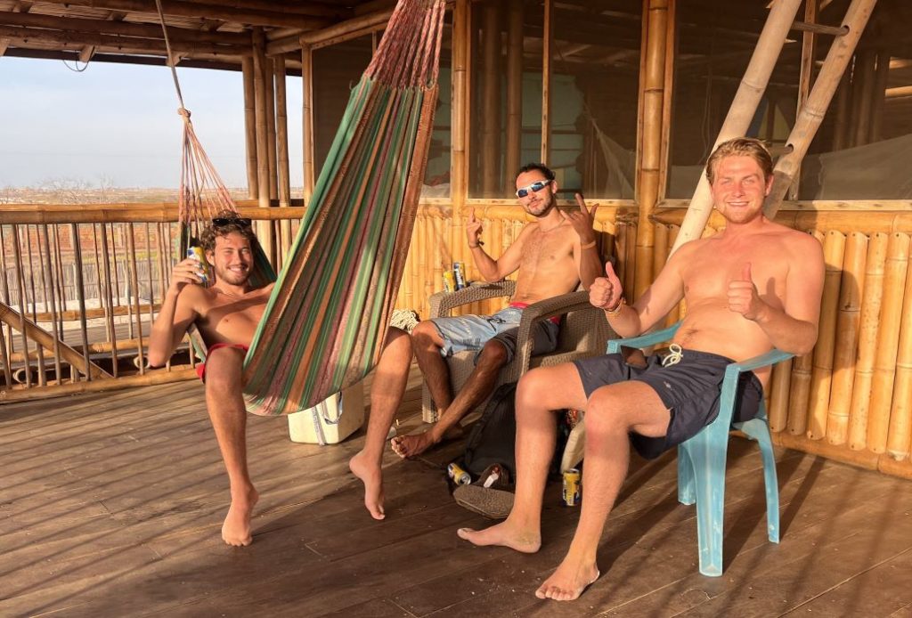 Friends gathering on the balcony of Casa Coral after a day on the water at Eoletto School.